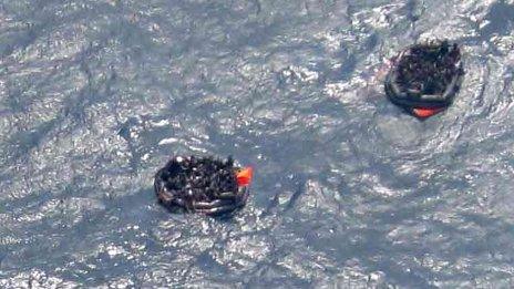 Aerial view of people in life-rafts after the ship sank on 2 February 2012