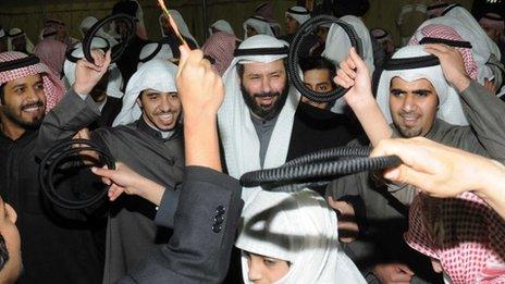 Kuwaiti opposition candidate Faisal al-Mislem celebrates with his supporters (3 February 2012)