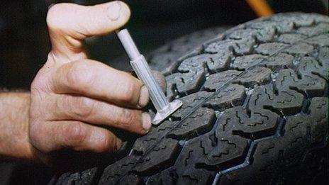 Tyres in car garage tested for tread depth