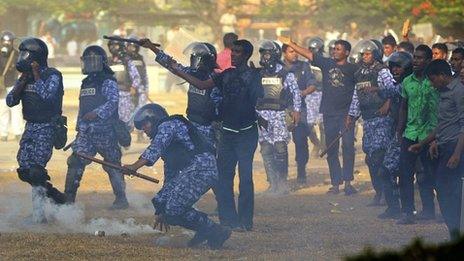 Police clash with the military during protests in the Maldives on 7 February 2012