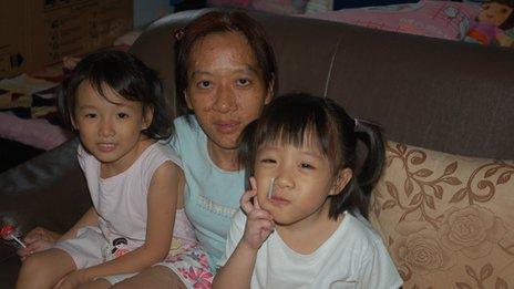 Ng Siew Teen and her daughters at home in Singapore on 2 February, 2012