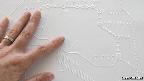 Reading a Braille map of the Paris Metro