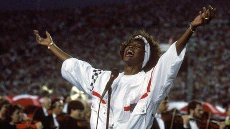 Whitney Houston performs at the Super Bowl in 1991