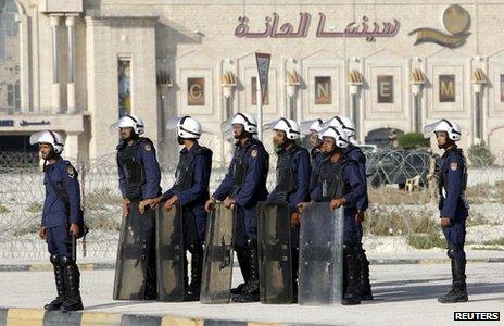 Riot police guard an entrance to the site of the now-demolished Pearl Roundabout (14 February 2012)