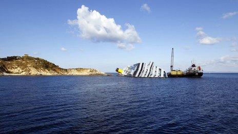 Oil recovery vessels work beside the wreck of the Costa Concordia at Giglio Island, western Italy, 15 February