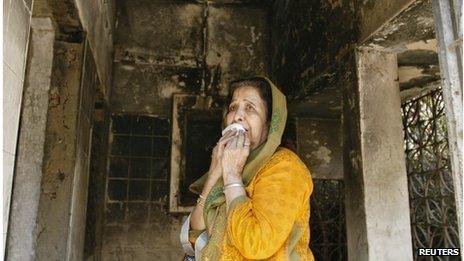 A survivor inside her home that was burnt in the riots in the western Indian city of Ahmedabad February 27, 2012