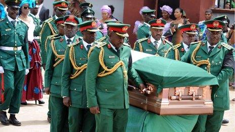 Army pall bearers carry the casket of Nigeria"s secessionist leader Odumegwu Ojukwu into St Michaels Catholic Church, for the funeral service in Nnewi, in Anambra State eastern Nigeria, on March 2, 2012.