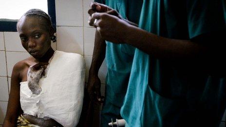 A Congolese woman is treated on March 5, 2012 in the central hospital for the injuries she suffered during the March 4 gigantic blast after an ammunition depot exploded in the capital of the Republic of Congo, Brazzaville, killing around 200 people and injured over 1000