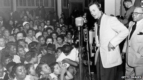 Alan Freed appears on stage the night of the Moondog Coronation Ball in Cleveland on 21 March 1952