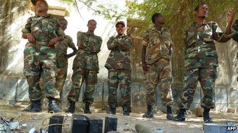 Ethiopian soldiers displaying weapons belonging to Somali militants 2 March 2012