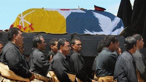 The royal casket of King George Tupou V is carried towards the royal tombs during the state funeral on 27 March, 2012