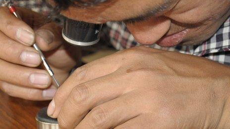 Namgyal working on a watch