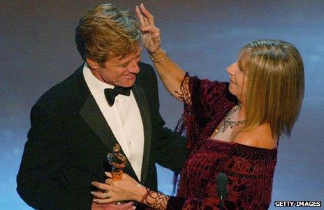 Robert Redford receives his honorary Oscar from Barbra Streisand