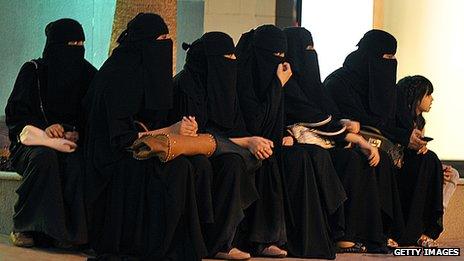 Saudi women waiting for their drivers outside a mall in Riyadh