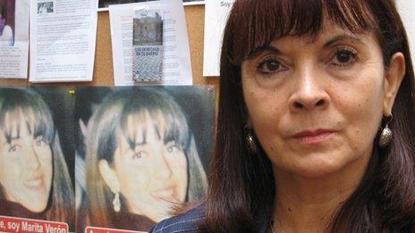 Susana Trimarco in front of pictures of her daughter known as Marita