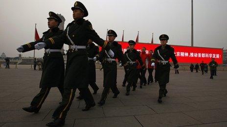 Paramilitary policemen patrol on Tiananmen Square - archive image