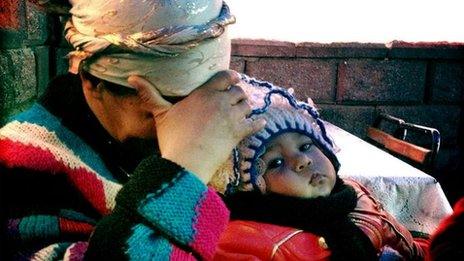 An Uzbek woman and child