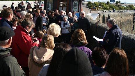 Crowd gather for unveiling of Guernsey Titanic plaque