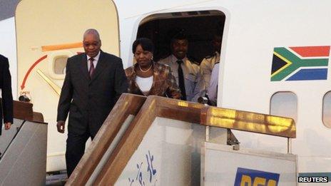 South Africa's President Jacob Zuma and his partner Gloria Bongi Ngema arrive at Beijing international airport (August 23, 2010 file)