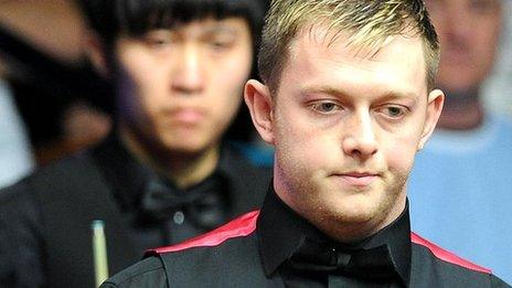 Mark Allen, with Cao Yupeng in the background
