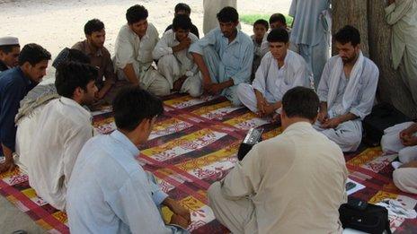 Men listening to New Home New Life