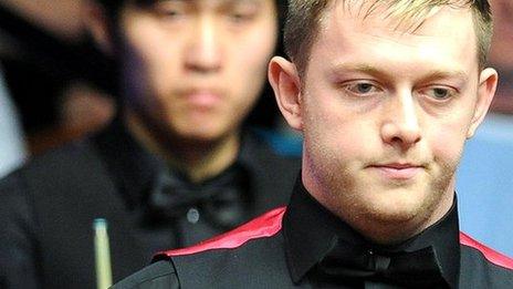Mark Allen, with Cao Yupeng in the background