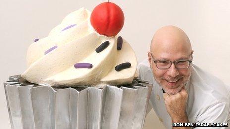 Ron Ben-Israel with a giant cupcake