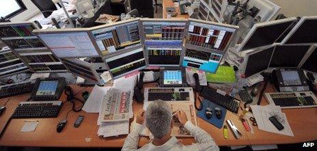 Trader with computers