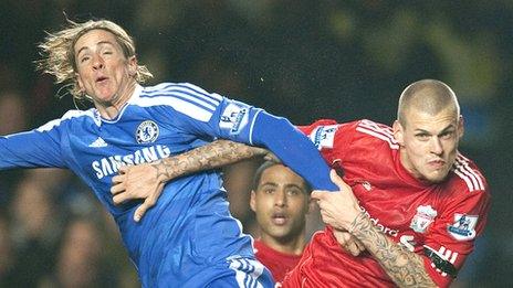 Chelsea's Fernando Torres (left) challenges with Liverpool's Martin Skrtel (right)
