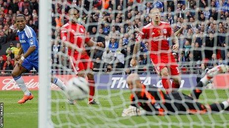 Chelsea striker Didier Drogba scores against Liverpool in the FA Cup final