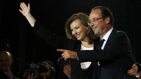 French president-elect Francois Hollande and Valerie Trierweiler greeting crowds gathered to celebrate his election victory in Bastille Square in Paris, France, 6 May 2012.