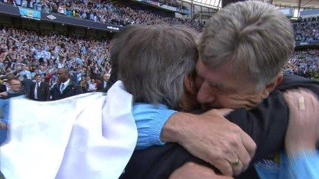 Manchester City's Roberto Mancini and Brian Kidd celebrate