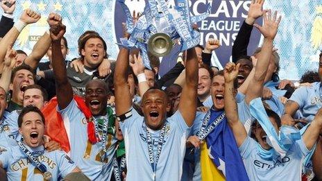 Manchester City captain Vincent Kompany lifts the Premier League trophy
