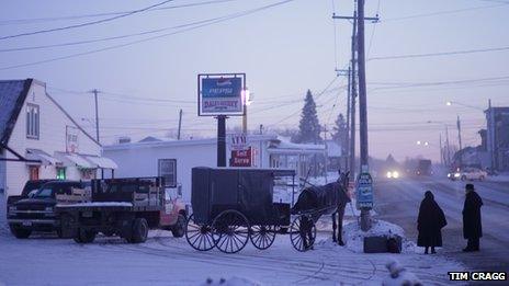 Amish people waiting for a bus in Canton, NY