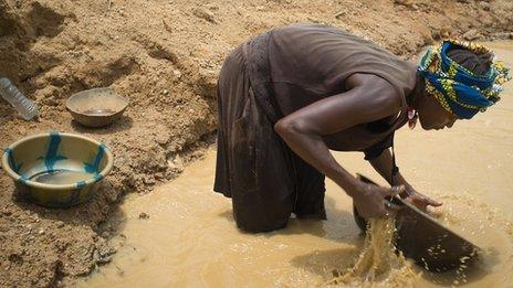 Woman panning for gold