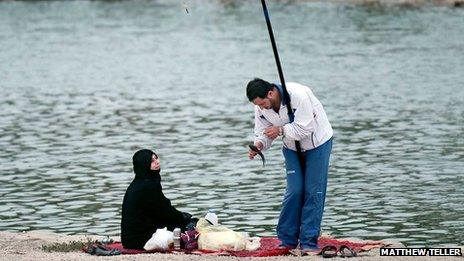 A man and a woman fishing