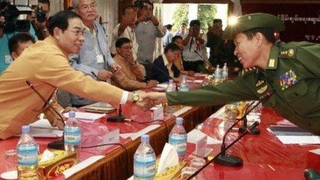 Shan State Army leader Yawd Suk (left) shakes hand with General Soe Win from the Burmese Army.