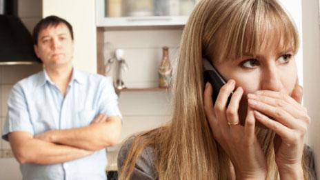 Woman secretly talking on phone
