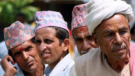 Nepali men wearing the traditional caps