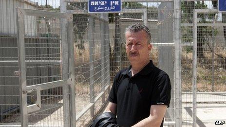 Bassem Tamimi stands outside Israel's Ofer military court near the town of Ramallah in the West Bank on 20 May.