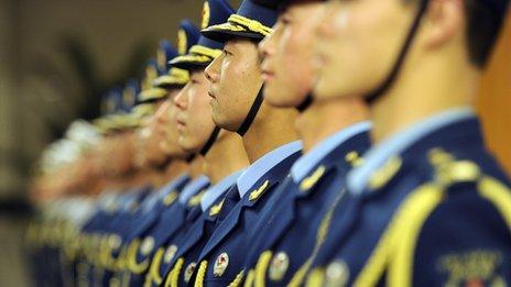 Members of Chinese military honour guard stand in a line at the Great Hall of the People in Beijing, 9 April 2012