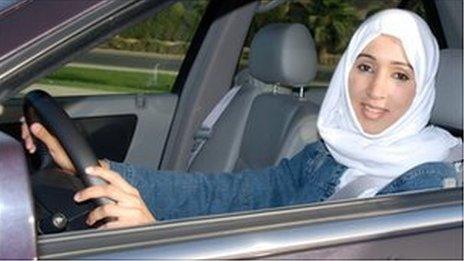 A photo of Manal al-Sharif behind the wheel of a car, taken last year