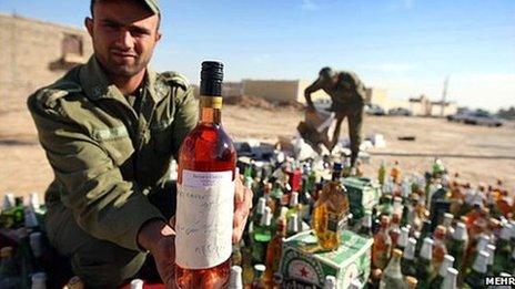 Soldiers inspecting seized alcohol