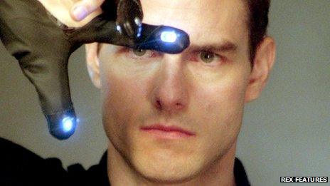 Tom Cruise as John Anderton (wearing a "data glove") in the film Minority Report