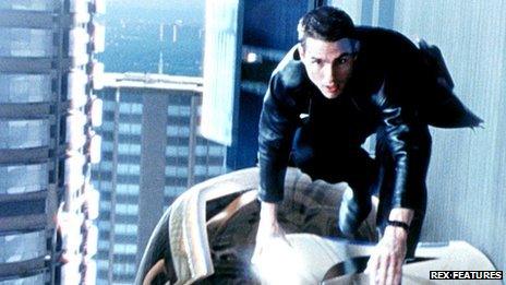 Tom Cruise on top of a car in the film Minority Report