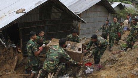 Army personnel take part in the rescue operation after a landslide in Chittagong
