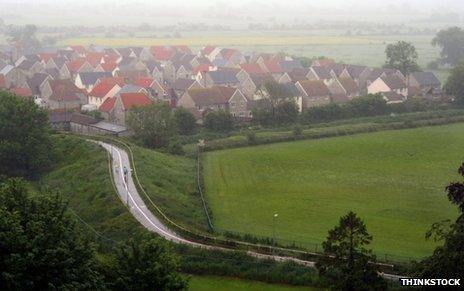 Clustered houses surrounded by fields