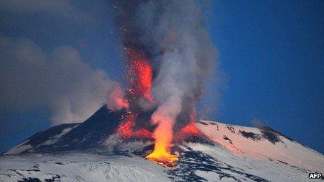 Lava spews from a crater of the giant Etna Volcano on the southern Italian island of Sicily