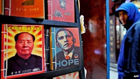 Notebooks printed with portraits of late Chinese Communist leader Mao Zedong (L) and acting president of the United States Barack Obama