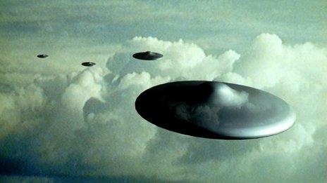 Artist's impression of flying saucers in flight